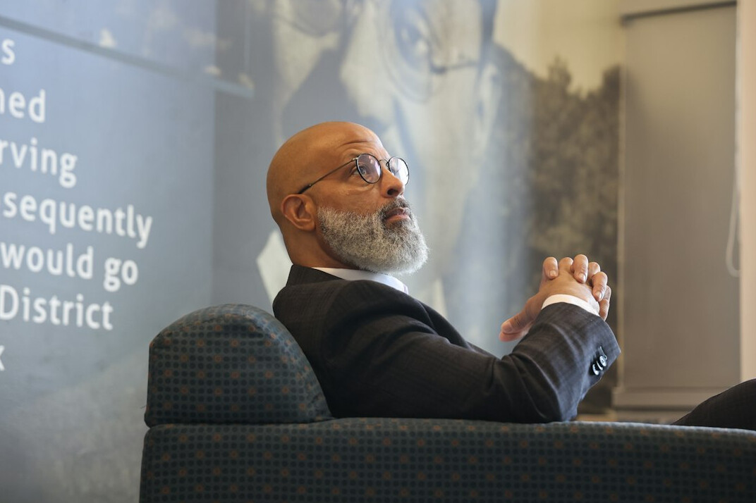 Portrait of a male professor with short beard and glasses